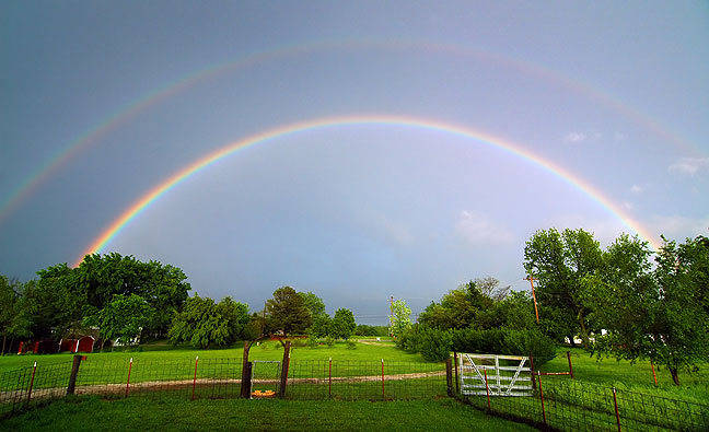 Double rainbow, our front yard, spring 2006. I received more compliments on this one image than on all the rest I published that year.