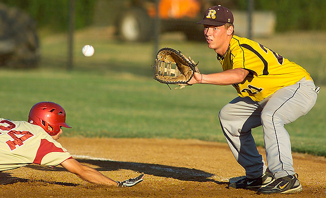 Baseball action from last night, about 20 minutes before sunset, shot with the 400mm f/3.5 AI-Nikkor at f/4, 1/2000th of a second, on the Nikon/Kodak DCS 720x.