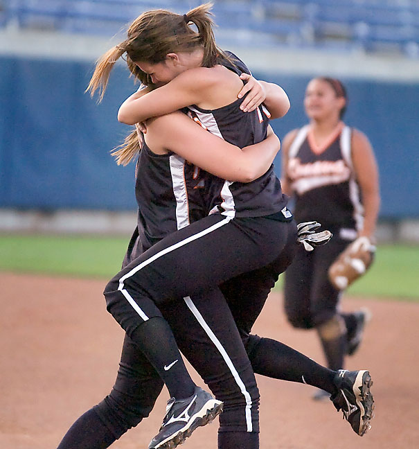 Moments earlier, those same softball players won a state championship game, as illustrated by this image.