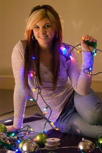 Devon Liljequist poses with some Christmas lights; she is a part time model.