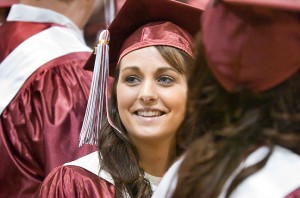 Kaitlyn Hooper looks up into the audience at Ada High School graduation ceremomies at the Cougar Activity Center Thursday night, May 19, 2011. This image conveys so much more than a picture of her receiving a diploma or posing for the camera.