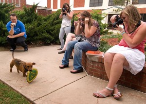 My crew takes a moment out of their campus tour to photograph a Frisbee-catching dog named Jake.
