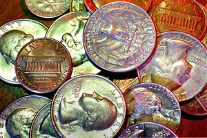 I made this image of coins on my desk in 1984. I turned off all the room lights, opened the shutter, and flashed the coins four times, each with a different colored gel on the flash. I got the results back from the processor a week later.