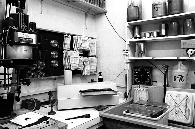 This is a corner of the small darkroom Ed Blochowiak and I shared in the 1980s. Note the chemistry: in pouches on the pegboard are developers DK-50, D-76, Microdol-X, and Dektol. On the shelf to the right are developers Diafine and Acufine. The sink holds tanks for fixer and rinsing.