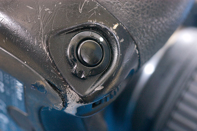This is the vertical release on one of my D2H digital SLR cameras. As you can see, it is well-worn. This illustrates two important things I demand from my work cameras: a vertical release, and a body that can take this kind of wear and tear year after year.