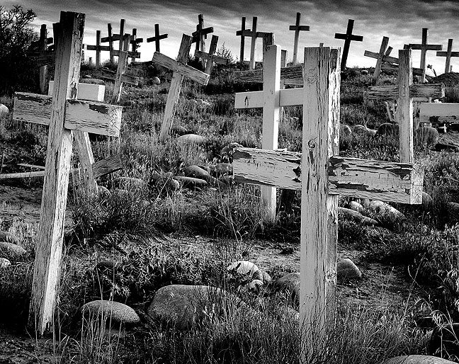 I photographed this mission graveyard on the Bisti Highway south of Farmington, New Mexico on a bitterly cold morning in November 2003.