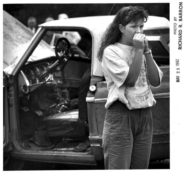 A young women reacts with dismay at the scene of a quadruple-fatality accident involving a funeral procession west of Ada Friday, May 29, 1992.