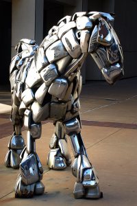 A horse sculpture made from chrome car bumpers stands on the street in downtown Wichita, Kansas in November 2003. I photographed it with the D100.