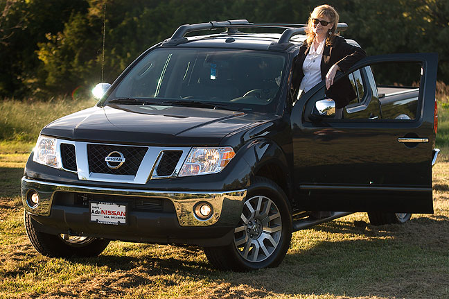 Abby poses with her Frontier pick-up; it took our dealer a couple of weeks to find just the right one.