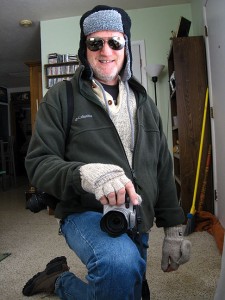 Ready to go outside in the 12º weather: insufferably warm ragg wool sweater, Columbia fleece, ski hat, photographer's mittens, and my darkest sunglasses.