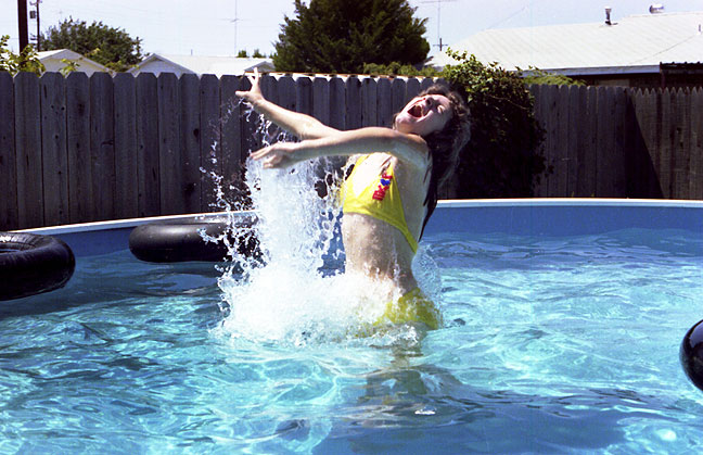 Nicole splashes up out of the water in our new swimming pool. This was one of my very first attempts to use a fast shutter speed to freeze motion in a subject.