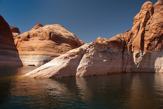Stark, angular, colorful, and beautiful, this image made in Forbidden Canyon, an arm of Lake Powell, is similar to some of the scenes in the early minutes of Planet of the Apes.