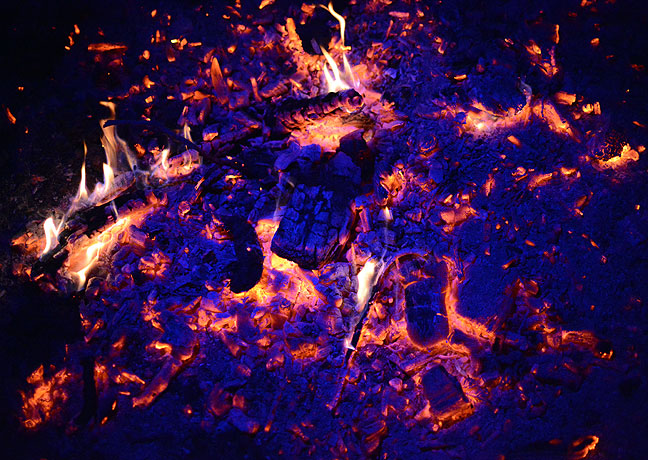 As my fire went to coals, I played around with illuminating it with a red-blue-white selectable flashlight. This image was made at ISO 6400.