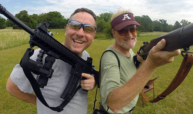 Scott Andersen, left, and I pose for a photo at my shooting range yesterday morning. I am holding a Springfield 03a3, and Scott has my Smith and Wesson M&amp;P 15/22, which he decided, correctly, is the most fun firearm ever made.