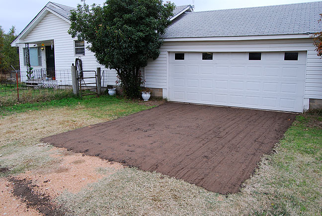 This is the new asphalt driveway patch in front of the garage. I'm glad I was around to take this guy's offer. This spot was previously subject to getting kinda messy when it rains or snows.