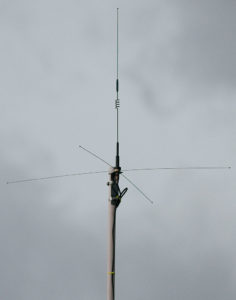I recently stuck this Comet B-20 dual band mobile antenna up on a piece of PVC pipe at the corner gable of the garage so I could use amateur radio while I am working out there. My first contact on it was with a fellow amateur operator on a repeater in Norman, Oklahoma about 65 miles away.