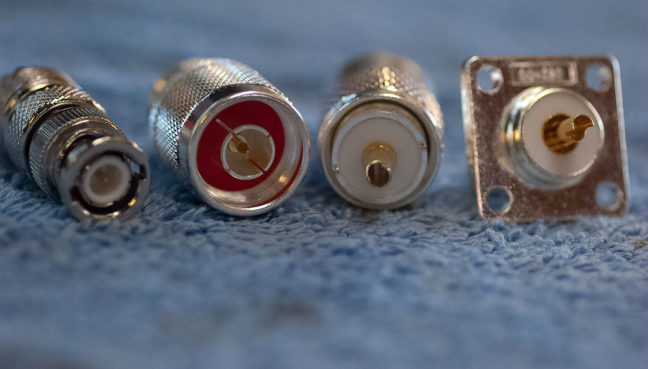 I am hopeful that I can get some of the stuff I bought at Ham Holiday Saturday put into service today. These connectors are, from left to right, a BNC to PL-259, an N to PL-259, a solderable PL-259, and a chassis-mount SO-239.
