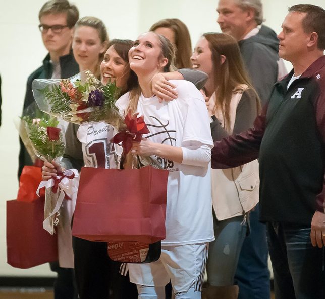McKenzie Dean was one of the senior players honored last night. She is pictured with her parents, Angie and Steve Dean, and her sister Haley Dean. I have been photographing the Deans for most of my career.