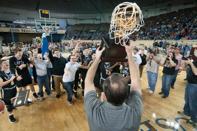 The Latta Panthers receive their Class 2A championship trophy today in Oklahoma City.