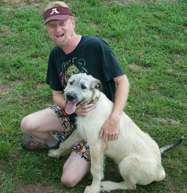 Your humble host poses with Hawken, the derpy, goofy Irish Wolfhound puppy just four months old.