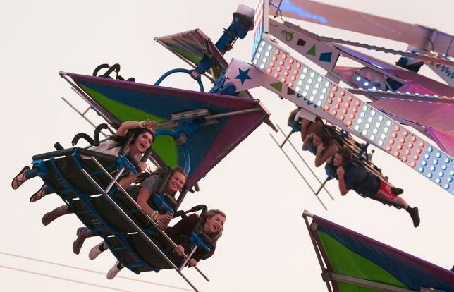 Few things cheer you up better than being with or watching happy people, as in this image I made of a ride at the Pontotoc County Free Fair last night.