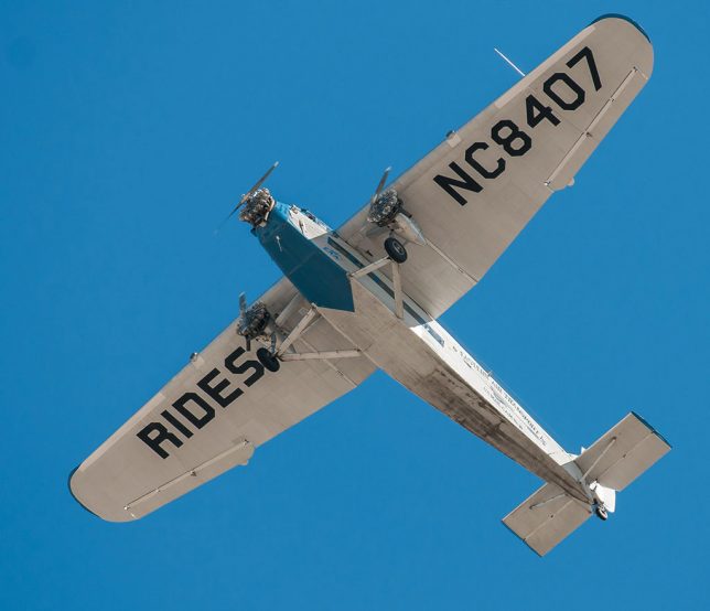 The EAA's historic Ford Tri-Motor lumbers overhead this morning. My media friends and I got to fly in her Thursday.