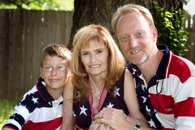 Mitchell and Abby pose with me for the July 4 holiday in 2006. Despite our efforts and Mitchell's potential, he was something of a lost cause.