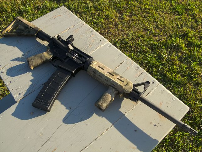 An AR-15 with a 40-round magazine? No. This is an automatic assault rifle machine gun with a huge clip. Thanks, media.