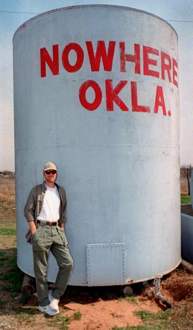 Your humble host of mumbles Richard R. Barron poses at the water tower in Nowhere, Oklahoma in 1999.