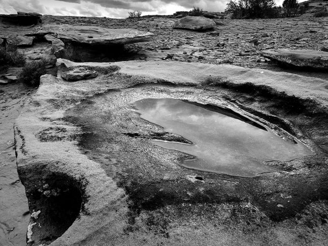 I photographed this puddle and sandstone formations near the Peñasco Blanco Great House at Chaco Canyon.