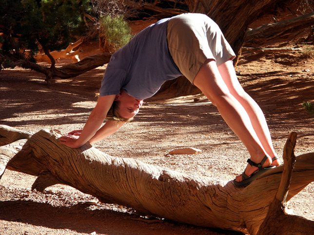 We found this young woman doing an arch pose in the opening of Navajo Arch in Arches National Park.