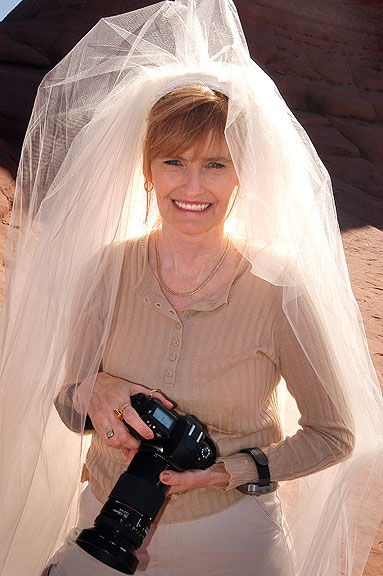 Abby holds her camera moments after the wedding ceremony.