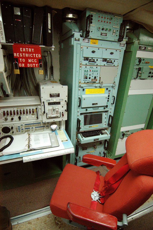 This view of a control station at Minuteman Missile shows the controls panel and the chair, which is bolted to a rail on the floor to help the crew ride out an attack.