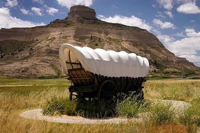 A covered wagon is commemorated at Scotts Bluff National Monument.
