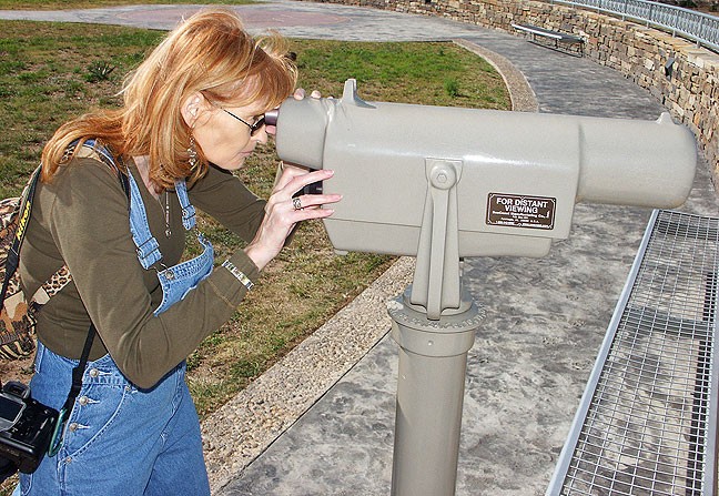 Abby looks through a telescope at "our" rest stop in the Texas panhandle.