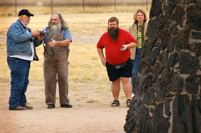 Visitors photograph the marker at the Trinity site.