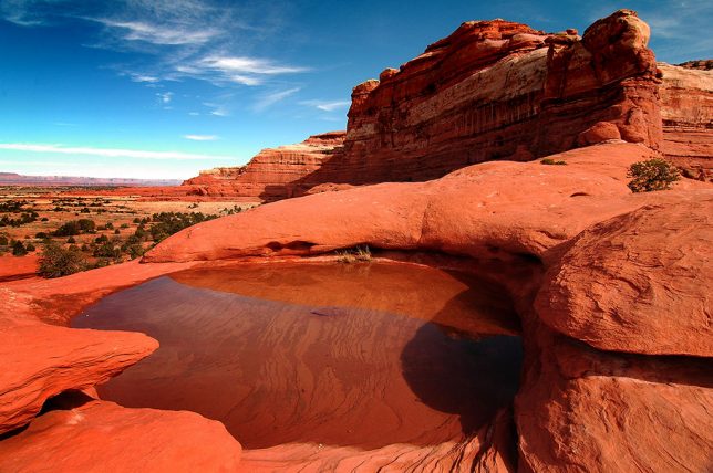 With potholes full of water and a cold, blue sky above, this spot, near Wooden Show Butte, is one of my favorites in the Needles District at Canyonlands National Park,