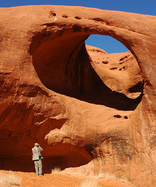 Abby photographed me photographing Mocassin Arch at Monument Valley.