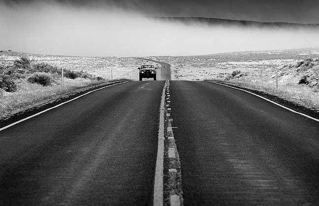 Snow blows across the road north of Monticello, Utah.