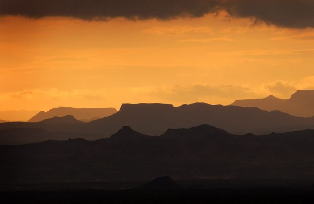The sun goes down behind the thunderstorm that tried to drown us at Terlingua Creek. The layers of mountains and the color palette made this image my favorite of the trip.