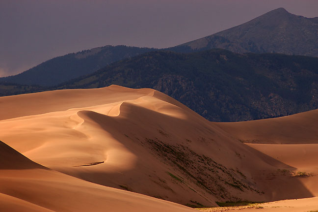 The dunes field of Great Sand Dunes with the Sangre de Cristo Mountains in the distance.