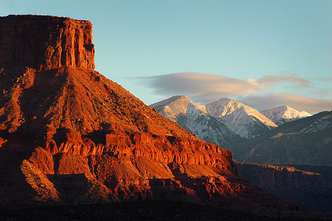 The La Sal Mountains and the mesas of Castle Valley, Utah take on last light. We spotted this on our way back to Moab after hiking at Fisher Towers.