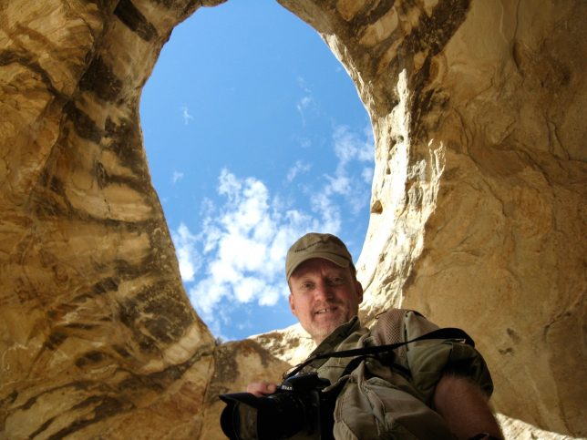 Your host poses with the Wild Horse Window directly above him.