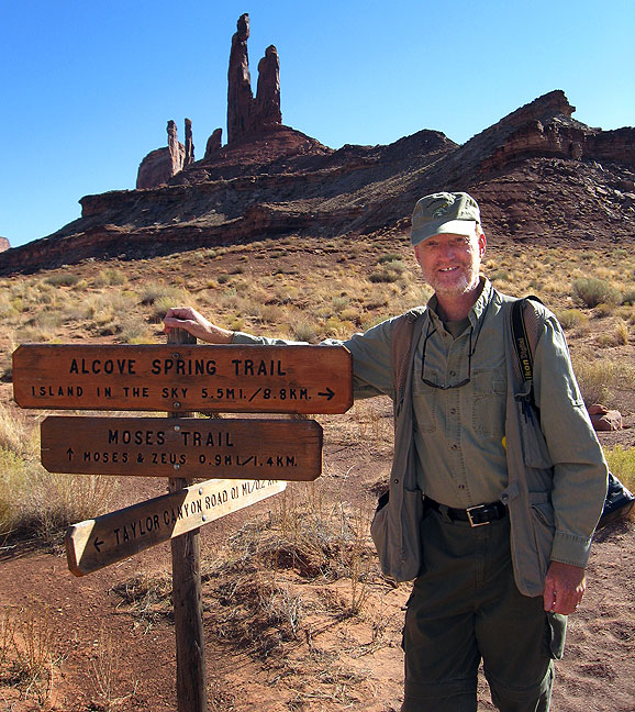Your host poses at the Zeus and Moses loop trail head at the end of the 5.1-mile Alcove Spring trail, Canyonlands.