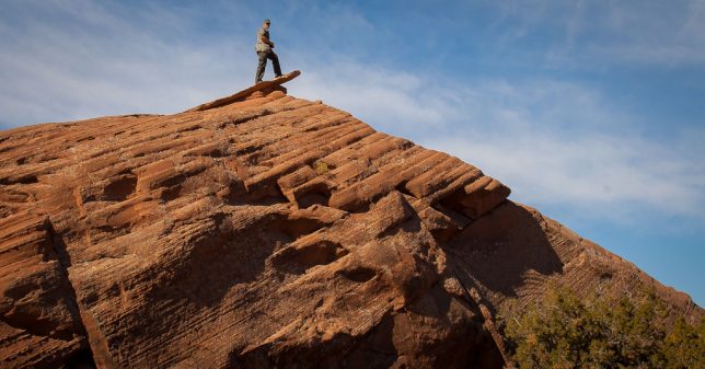 Your host poses on a formation called "The Diving Board" at Sand Flats Recreation Area east of Moab, Utah.