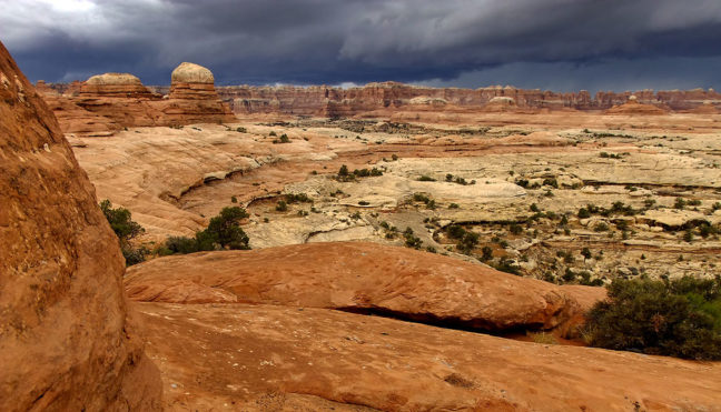 A beautiful and foreboding thunderstorm descends on The Needles at Canyonlands.