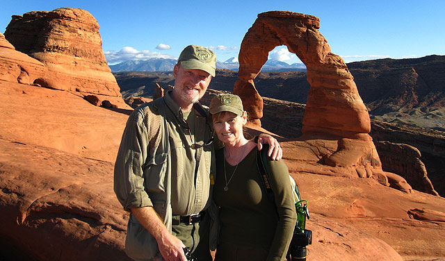 Abby and I pose in the spot where our marriage began, Delicate Arch in Arches National Park.
