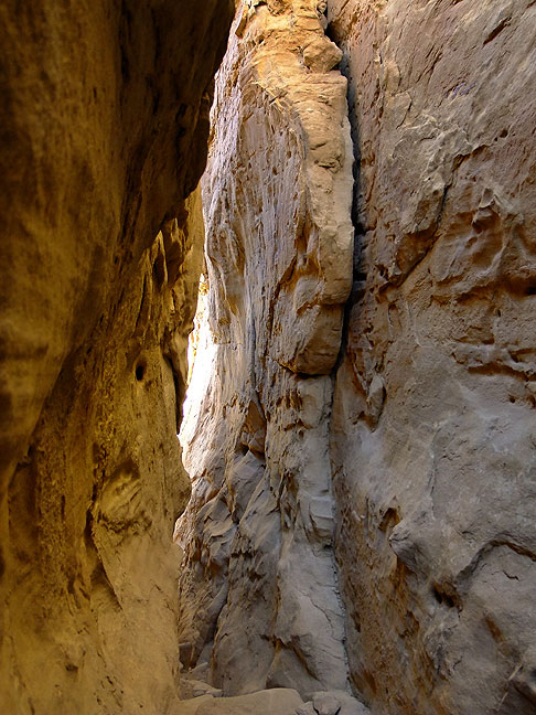 "The Crack" is a fissure in the northeast wall of Chaco Canyon through which the Pueblo Alto trail passes.