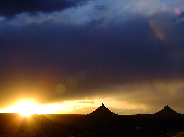 The sun sets behind South and North Sixshooter Peaks on the Indian Creek Scenic Byway.