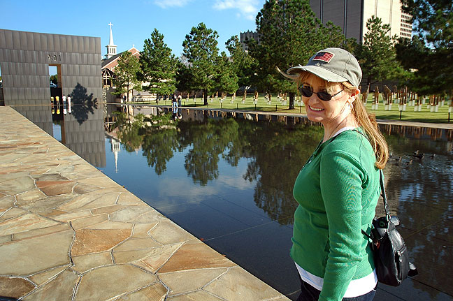Abby walks along the reflecting pool at the Oklahoma City National Memorial.